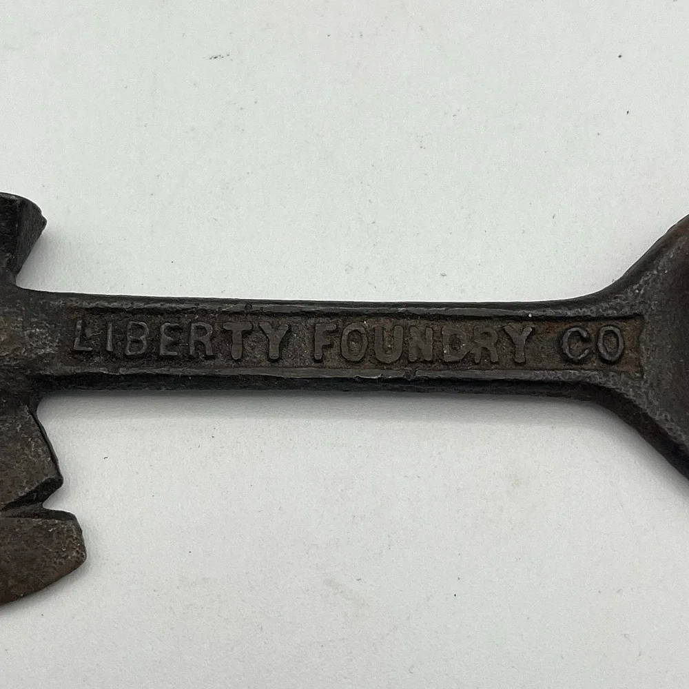 Vintage St Louis MO Liberty Foundry Bottle Opener Hatchet Cigar Cutter Cast Iron